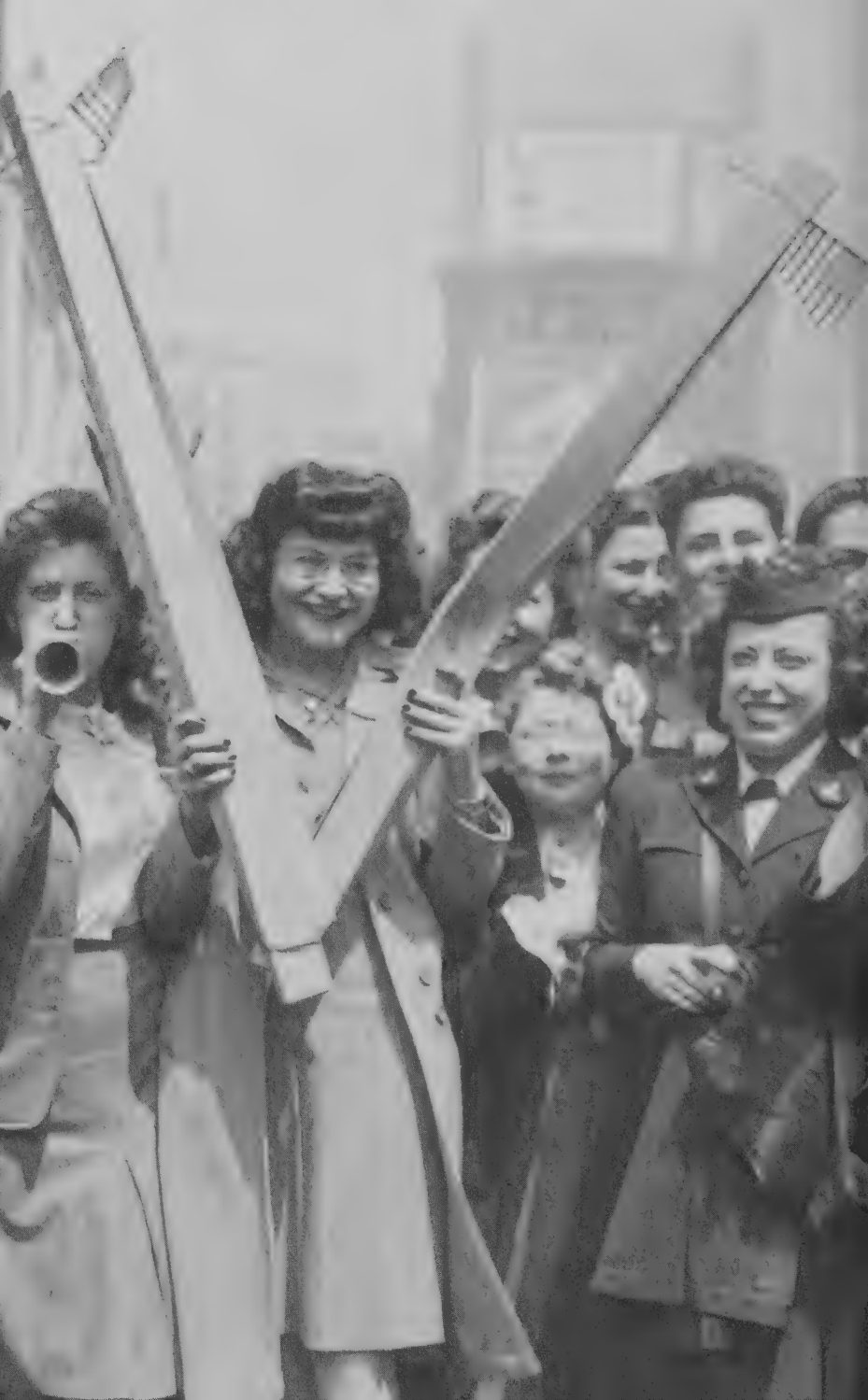 Detail of a photograph of people celebrating victory in New York City, 1945.