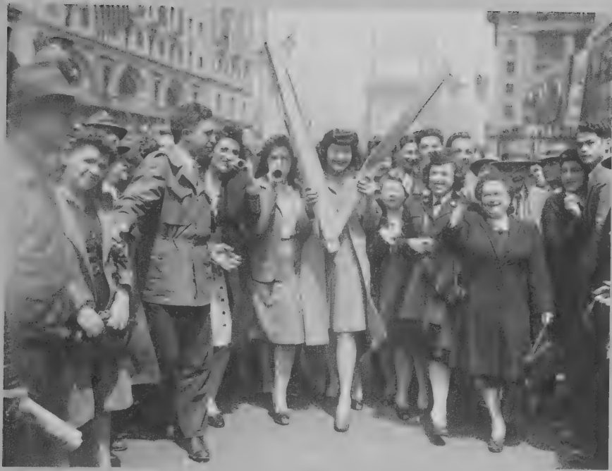 Photograph of white Americans celebrating a wartime victory in New York, 1945.