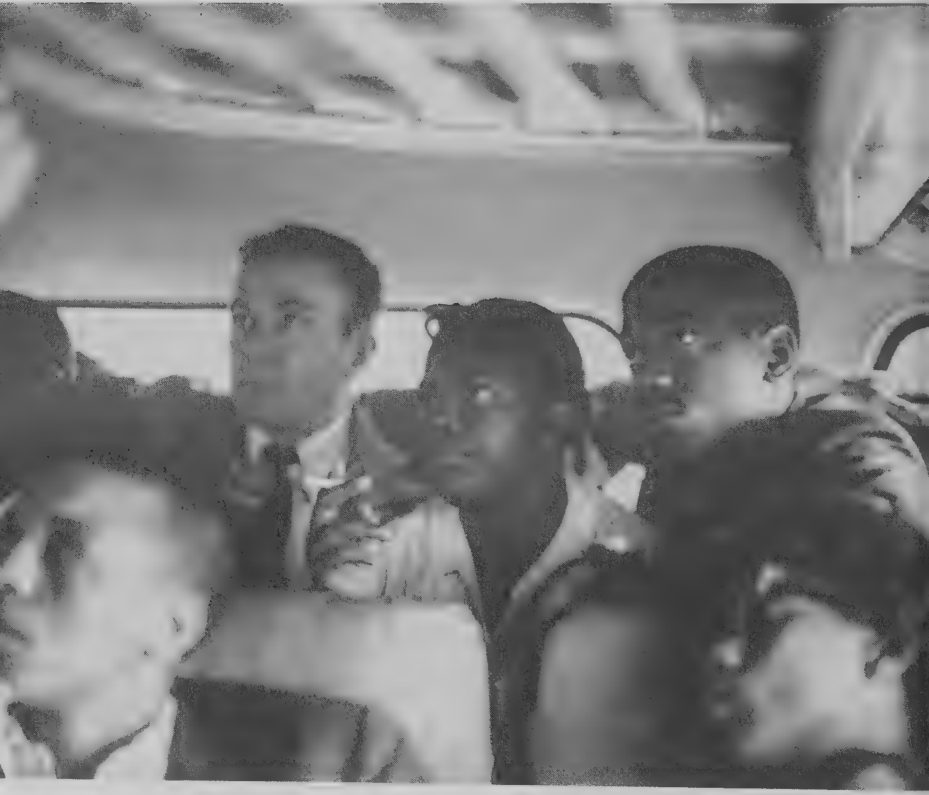 Photograph of Freedom Riders on a bus during a test trip into Mississippi, 1961.